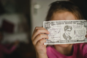 child playing with money
